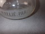 a glass jar with a label on it sitting on a table