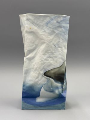 an image of a vase with a shark on it