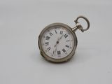 an antique pocket watch with roman numerals on a white background
