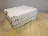 a white box on a wooden table with a google logo on it