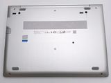 the back of a laptop with a small battery on top of it