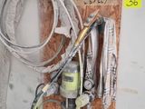 a picture of a kitchen with a sink and a hose
