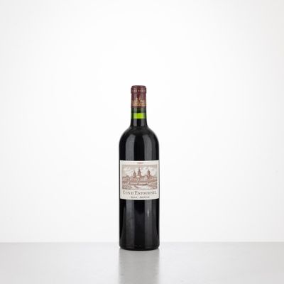 a bottle of red wine sitting on top of a table