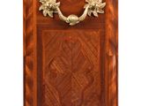 a wooden cabinet with a metal handle on it