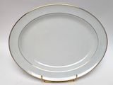 an image of a white and gold plate with a gold rim