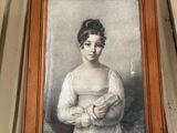 une photo d'une femme tenant un bébé dans ses bras