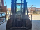 a forklift that is parked in a garage
