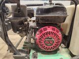 a close up of a small engine on a machine