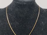 a gold heart necklace on a mannequin mannequin mannequin mannequin mannequin mannequin mannequin mannequin manne