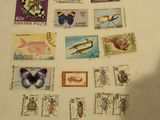 a lot of stamps that are on the table