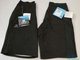 two pairs of men ' s black pants with tags on them