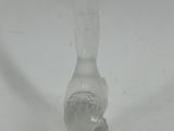 a clear glass object that is sitting on a table
