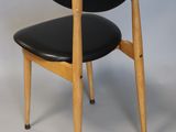 an image of a black chair with a wooden frame and black leather seat