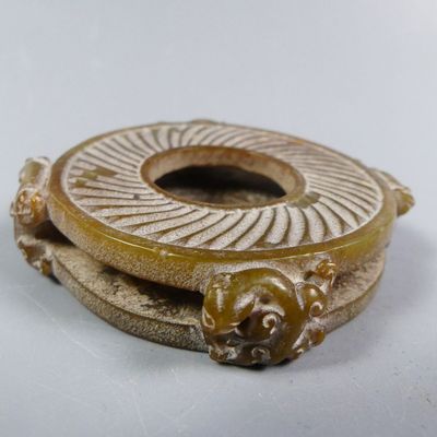 a picture of a gold colored object with a lion on it