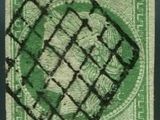un timbre vert sur lequel figure l'image d'une femme