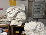 a pile of clothes on a table in a room