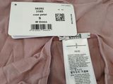 the back of a pink dress with a price tag on it