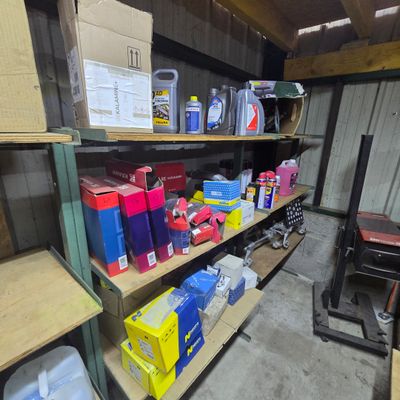 many boxes and boxes on the shelves in the garage