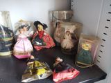many different figurines sitting on a shelf in a room