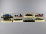six different models of cars in a display case