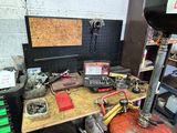 a workbench with tools on it in a garage