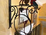 a metal sign hanging on the wall of a room