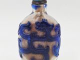 blue and white glass snuff bottle with a blue top