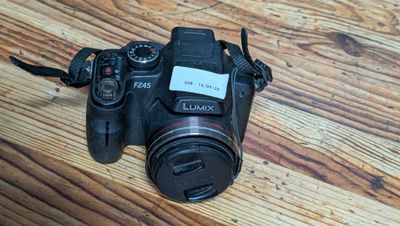 a camera that is sitting on a wooden table
