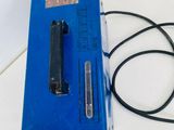 a blue box with a black cord attached to it