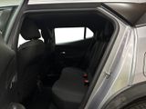 the back seat of a car with the door open and the driver ' s seat down