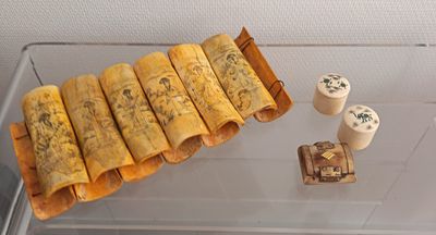 a glass display case with a variety of food items on it