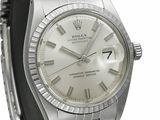 an image of a silver rolex watch with roman numerals