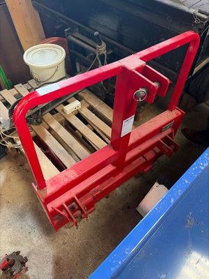 a picture of a forklift in the back of a pick up truck
