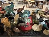 many different kinds of figurines on display in a shop