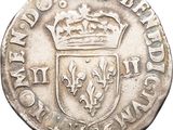 a close up of a coin with a crown on it