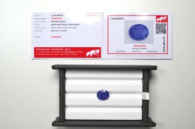 a picture of a business card with a picture of a blue diamond