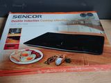 boxed picture of a tablet computer sitting on top of a wooden table