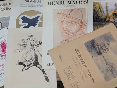 many different types of posters on the table