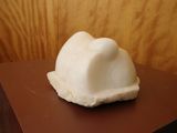 a small white cake on top of a brown table