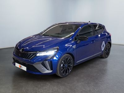 a blue car parked in a room with a white wall