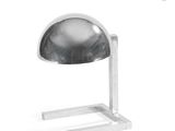 a lamp that is sitting on a stand on a white surface
