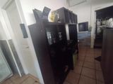 an image of a kitchen with a refrigerator and microwave