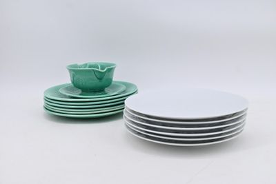 green and white plates and bowls on a white surface