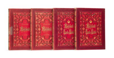 trois livres en cuir rouge ornés de motifs élaborés