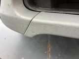a close up of a car door handle with scratches on it