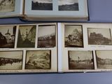 an open book with pictures of buildings on it sitting on top of a table