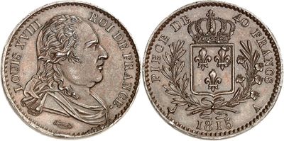 a silver coin with a crown on top of it