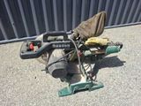 a lawn mower that is sitting on the ground
