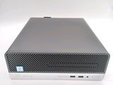 the dell desktop computer is sitting on a white surface
