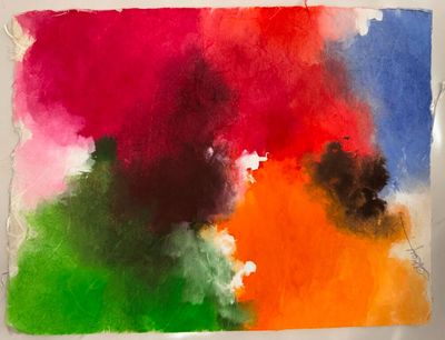 une peinture abstraite représentant une peinture multicolore sur une feuille de papier